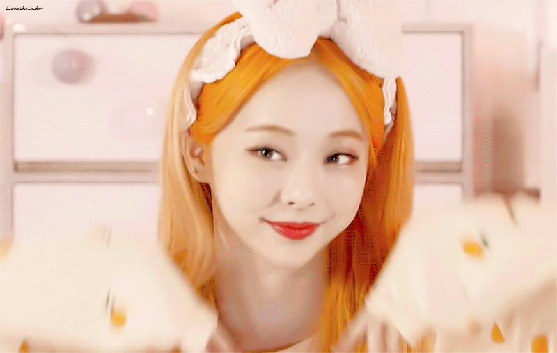 Vivi from Loona with a light orange aesthetic, not a link